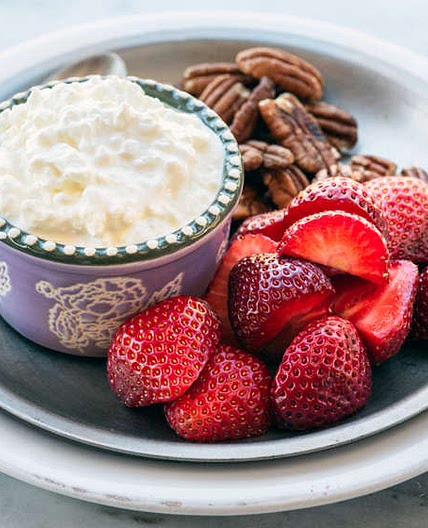 Breakfast bento with cottage cheese, berries and nuts