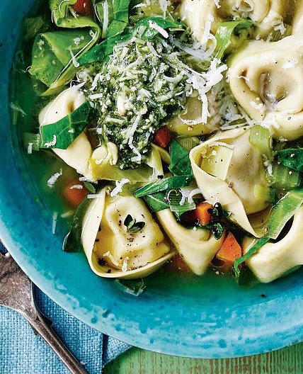 Spring green broth with tortelloni and pesto