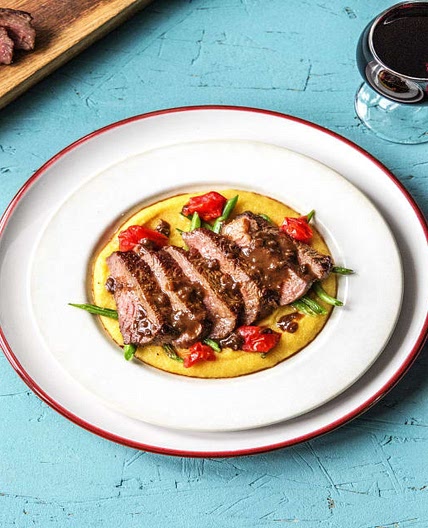 NY Strip Steak with Balsamic Reduction over Polenta, Blistered Tomatoes, and Green Beans