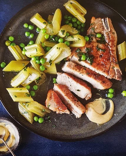 Pork chops with braised celery and peas