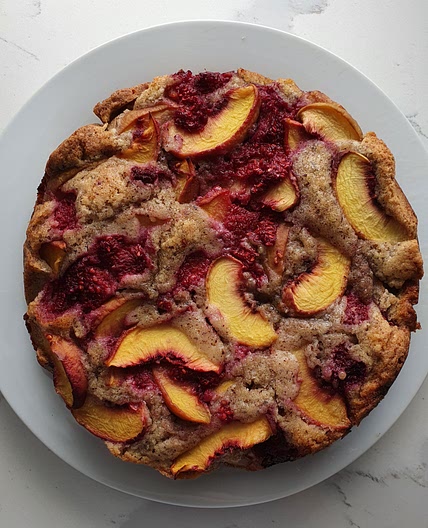 Hazelnut, peach and raspberry cake