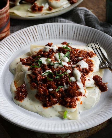 Afghan Gheymeh (tomato 'meat') sauce and yogurt mint sauce for topping Aushak.