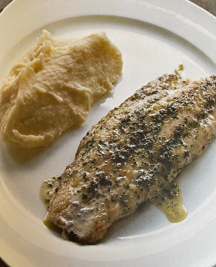 Fried fish fillets with herbs and lemon