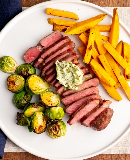 Strip Steak with Roasted Brussels Sprouts and Sweet Potato Fries