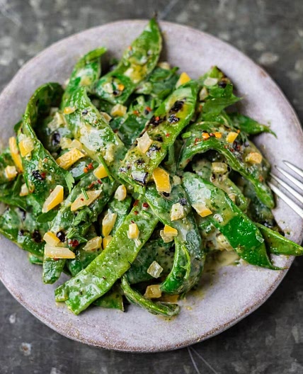 Griddled flat beans with burnt lemon tahini dressing