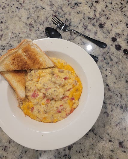 Rotel tomatoes, cheese Grits and Sausage "Bruncher"!