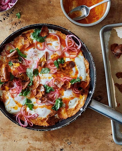 The Ottolenghi Test Kitchen’s Sweet Potato Shakshuka with Sriracha Butter and Pickled Onions