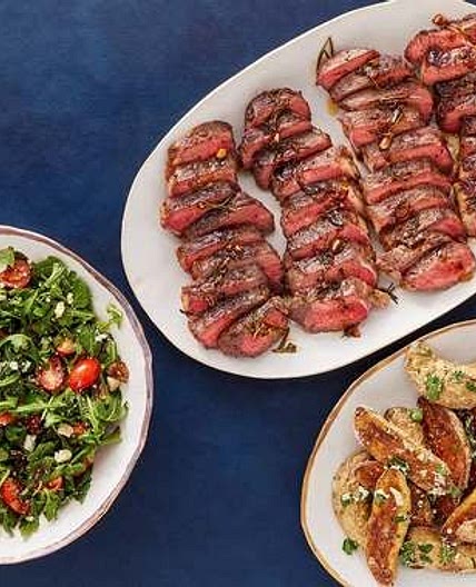 Pan-Seared Strip Steaks & Rosemary-Butter Sauce with Arugula Salad and Garlic-Parmesan Potatoes