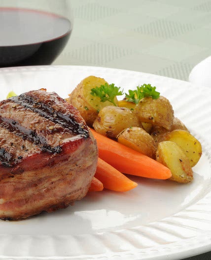 Bacon wrapped filets with baby potatoes