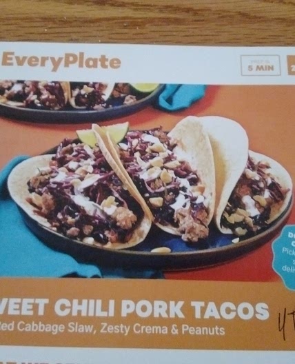 Sweet Chili Pork Tacos with Red Cabbage Slaw, Zesty Crema, & Peanuts