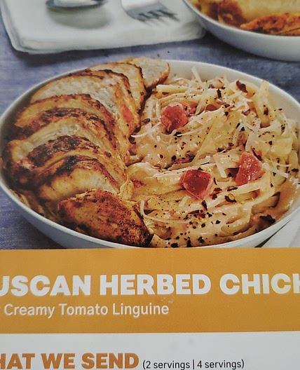 Tuscan herbed chicken over creamy tomato linguine