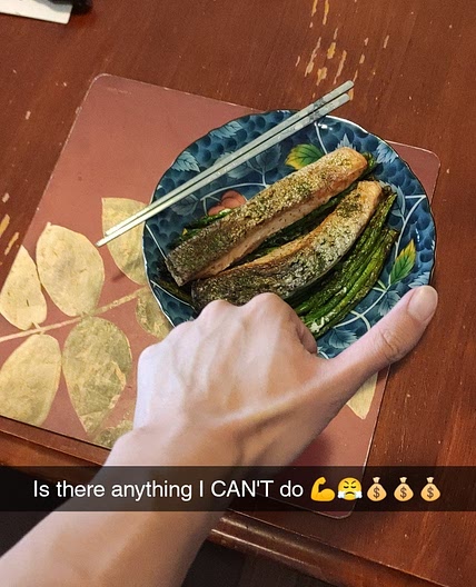 Salmon sleeping on a bed of Asparagus