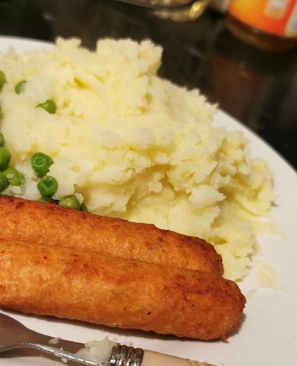 Vegetarian sausages,mashed potatoes, peas and gravy