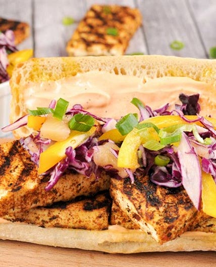 Jamaican Jerk-Seasoned Tofu Sandwich with pineapple-pepper slaw and Sriracha aioli