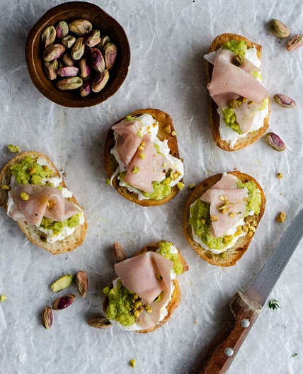 Burrata Crostini with Mortadella and Pistachio Pesto