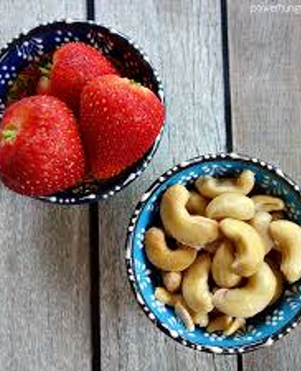 Raspberries or strawberries with cashews