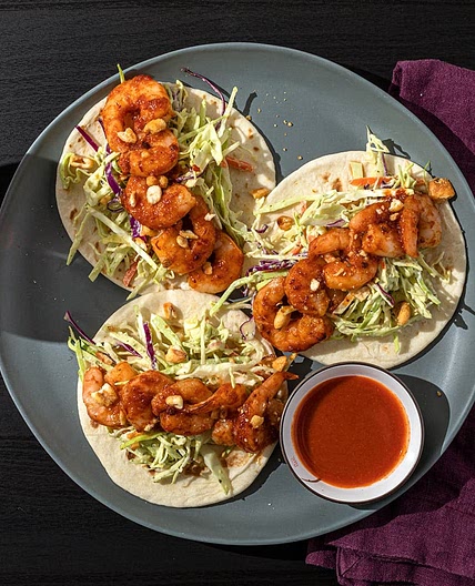 Honey Chipotle Shrimp Tacos with Avocado Lime Slaw & Corn Nut Crumble