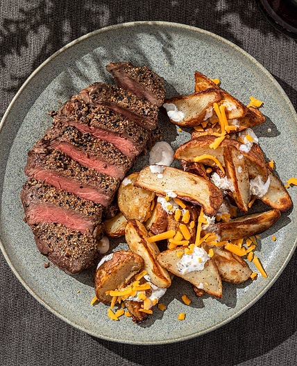 Garlic Pepper Steak and Loaded Potato Wedges with Cheddar & Bacon Sour Cream