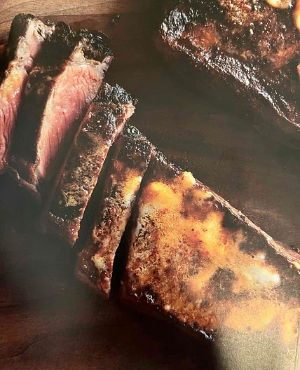 Strip Steak with Harissa Butter and Parsley Salad