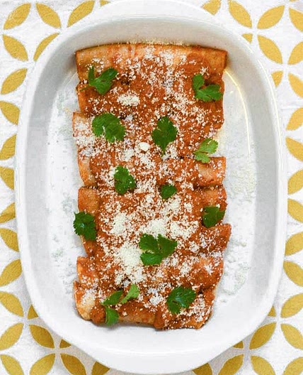 RED ENCHILADAS STUFFED WITH POTATOES, GREENS & PUMPKIN SEEDS