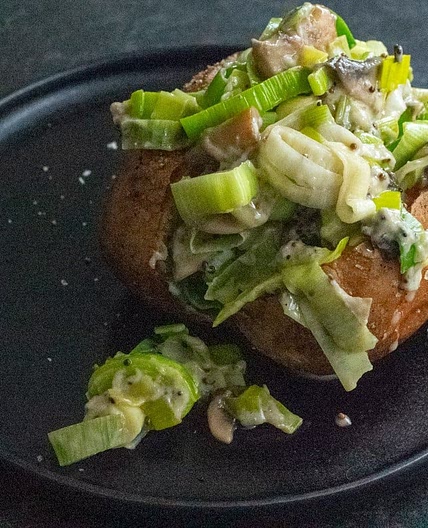 Humble jacket potato with mushrooms, leeks and cheddar cheese