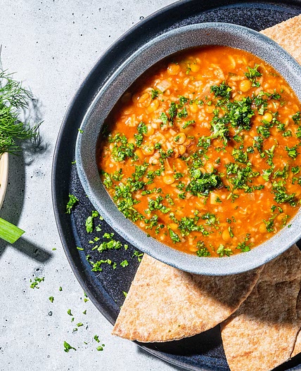 Hearty tomato-lentil soup is warm, tangy and filled with Persian flavors