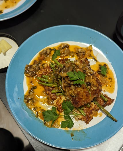 Panko Cod with Truffle Mushroom Sauce served over Cauliflower Fritters and Green Beans