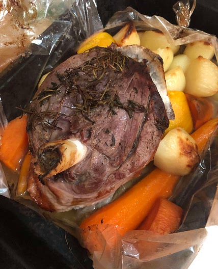 Roast lamb with rosemary and thyme in an oven bag