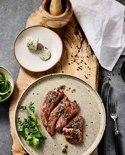 Rare beef steak with herb garlic butter