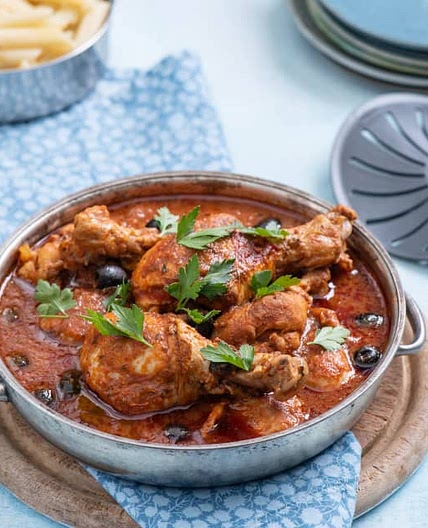 Chicken drumsticks in spicy puttanesca sauce