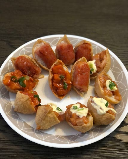 Inari sushi with salmon sashimi & pollock roe toppings