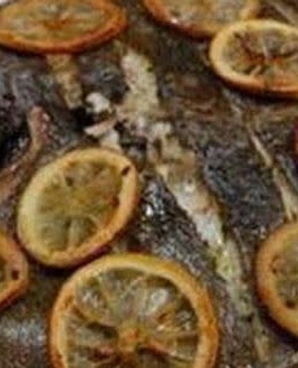 Whole baked turbot with lemon and herbs