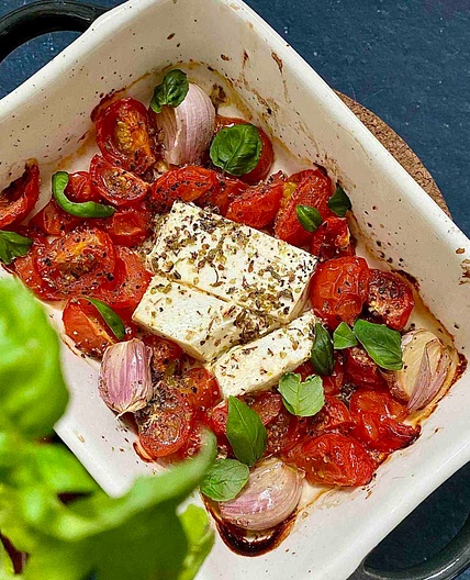 Oven baked white cheese with cherry tomatoes