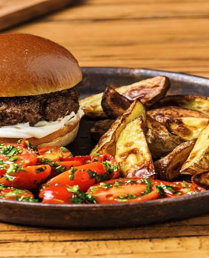 Herby Burgers and Wedges with Chimichurri Tomato Salad