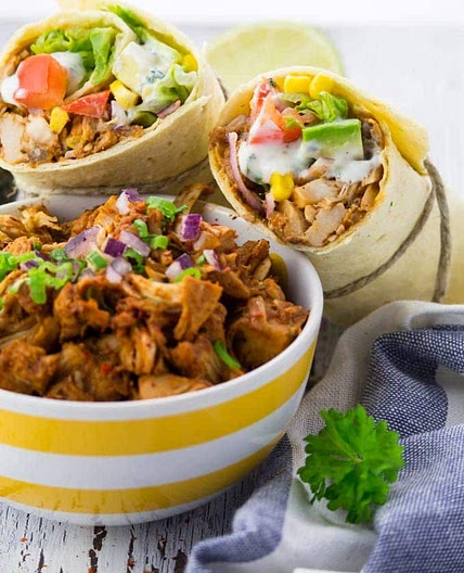 Vegan pulled pork wrap with sauce sage, spinach & tomato