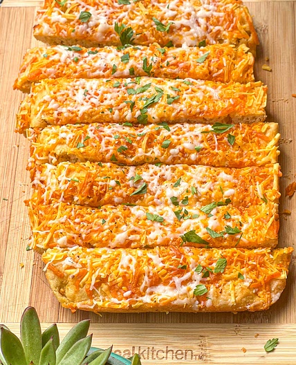 Cheesy Garlic Bread with Chili Oil drizzled on top. 