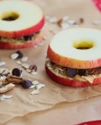 Apple sandwiches with granola and peanut butter
