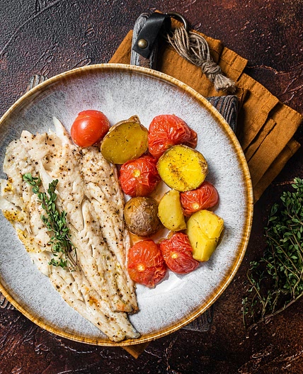 Appetizing Baked Haddock With Tomatoes, Olives and Caperberries