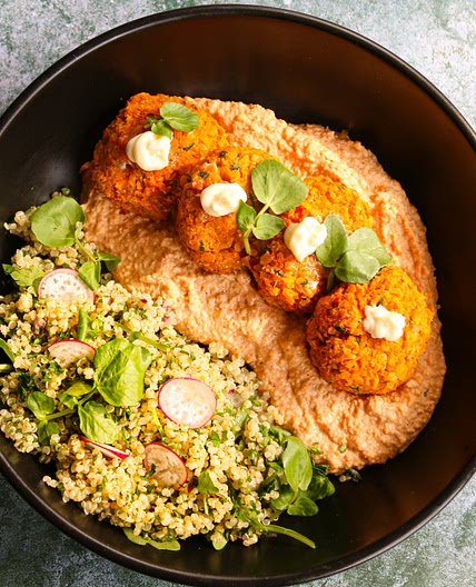 Carrot falafel with caramelised onion and paprika hummus and quinoa tabbouleh spring salad
