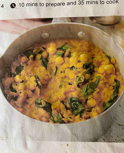 Coconut, spinach and lentil curry with naan bread