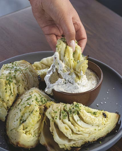Cabbage Baked in Embers with Yogurt, Sumac, and Lemon Zest