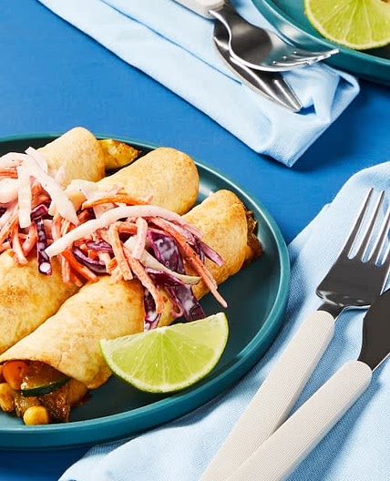 Cheesy Zucchini Flautas
with Cabbage Slaw