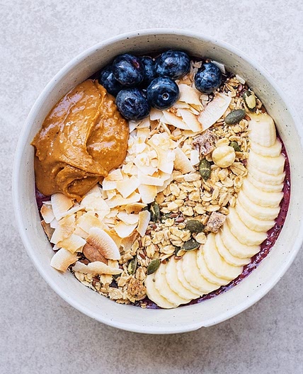 Açai bowl with blueberries, granola, banana and peanutbutter