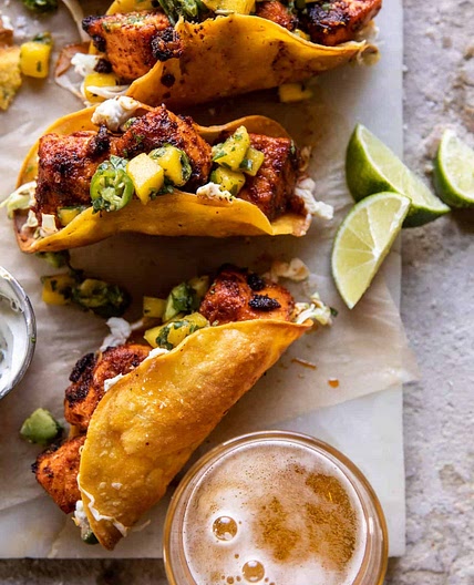 Crispy BBQ Salmon Tacos with Avocado Mango Salsa and Jalapeño Cream