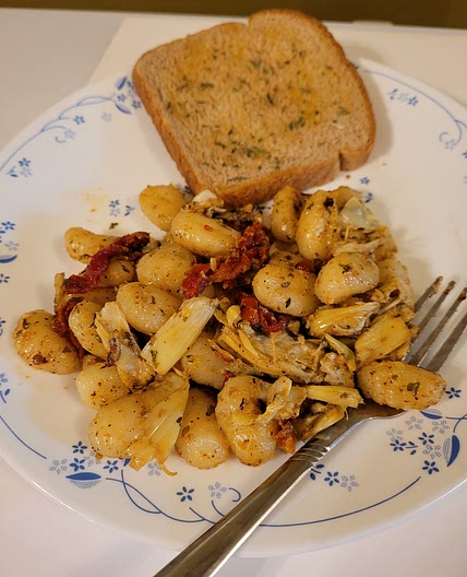 Sauted artichoke hearts with sun dried tomatoes and gnocchi