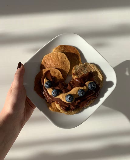 Banana pancakes with coconut pudding and peanut butter 