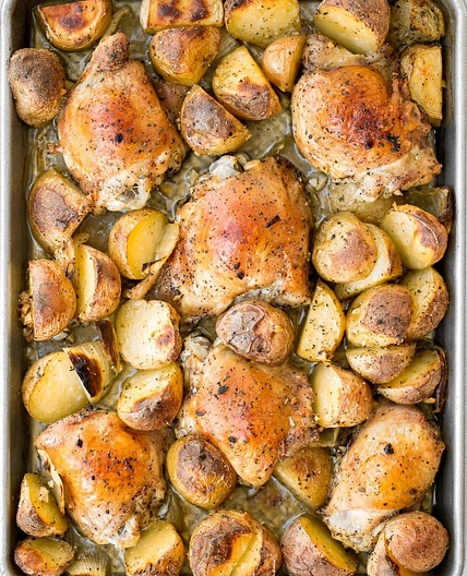 Roast chicken thighs with shmaltzy potatoes