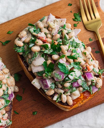 Mediterranean White Bean Stuffed Sweet Potato with Tahini
