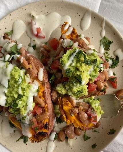 think nachos…. but on a potato? sounds weird but it’s SO GOOD lol recipe is below 🤓 cut sweet potato in half, coat in olive oil, &amp; bake at 400F for 30 minutes then add toppings of choice (i did cooked pinto beans, pico, guac, vegan sour cream, &amp; c