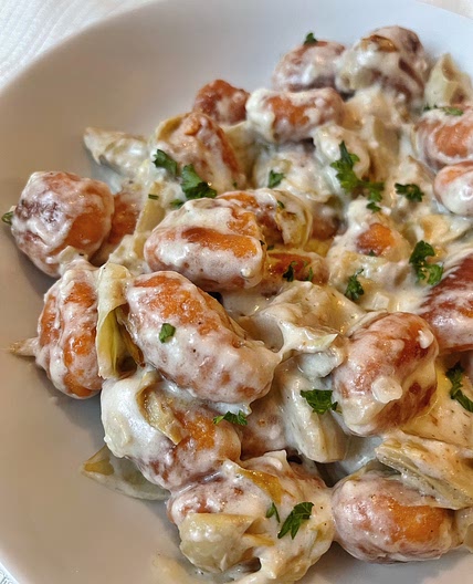 Sweet Potato Gnocchi with Creamy Garlic Parmesan Sauce and Crispy Artichokes